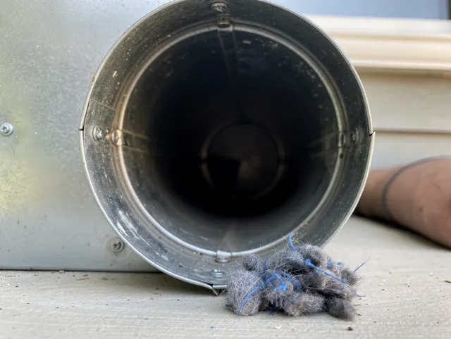 Riverview Dryer Vent Cleaning technician using specialized equipment to clear severe dryer vent blockage in Riverview